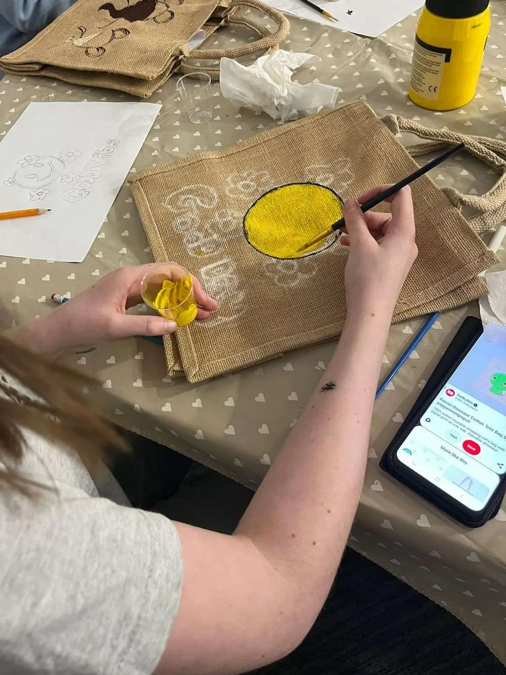People paining memory bags